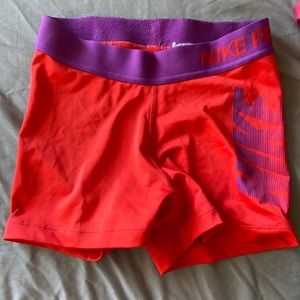Bright pink and purple Nike shorts